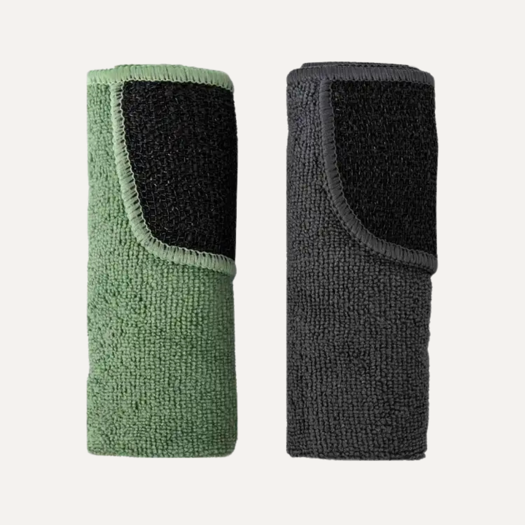 Two wristbands, one green and one black, on a light gray background. Simply Clean Microfibre Cloth with Scrubbing Corners