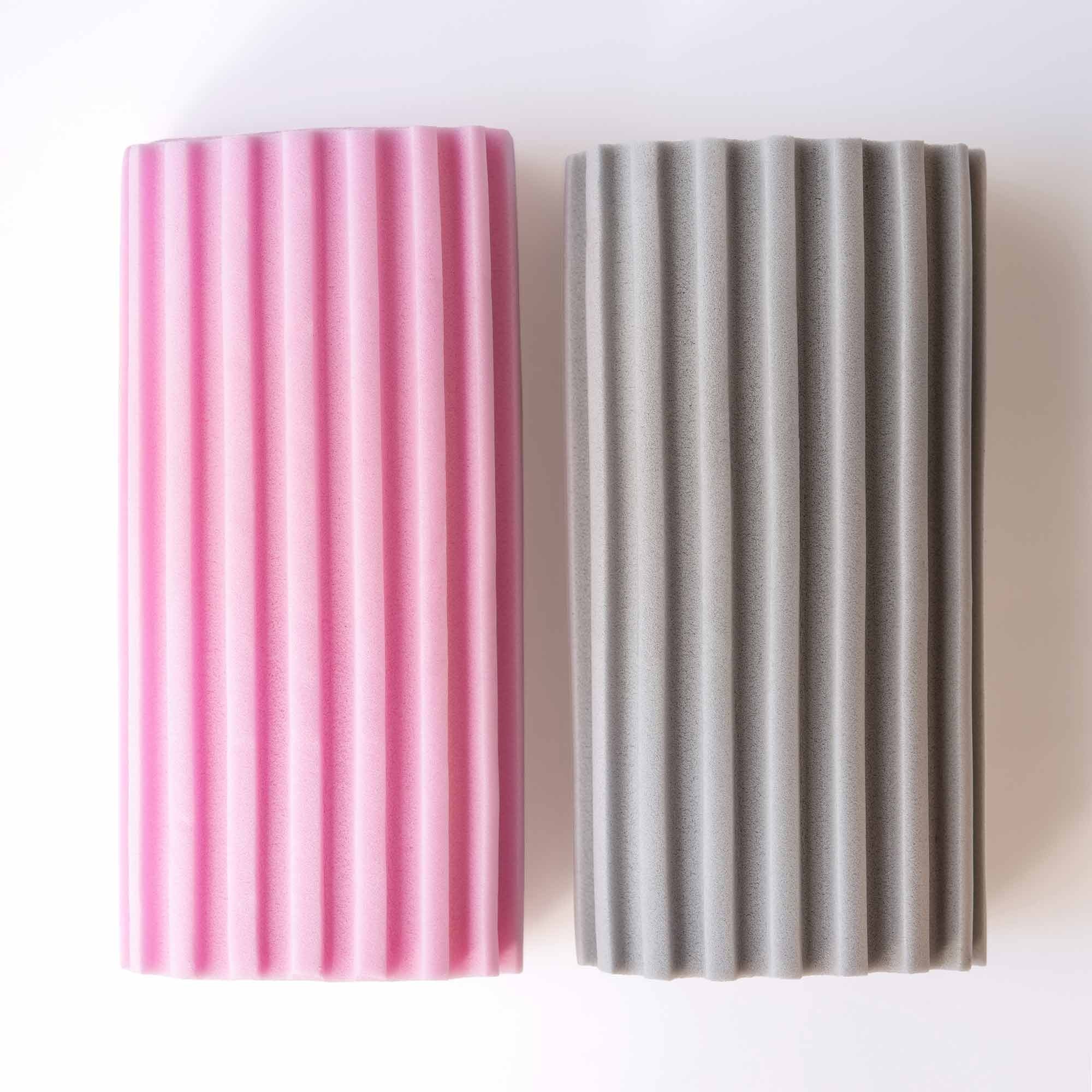 Two ribbed damp dusters, one pink and one gray, on a white background. Simply Clean Damp Duster Sponge - 2 Pack