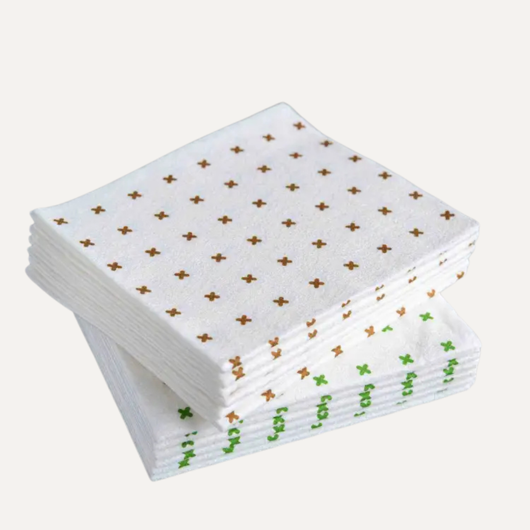 Stack of white cloths with gold and green patterns on a white background. Simply Clean Bamboo Cloth - 6 Pack